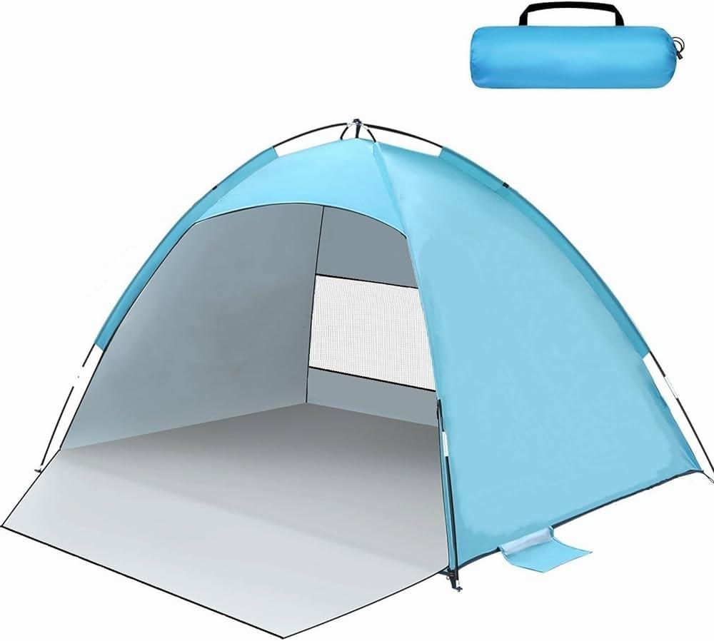 Une tente de plage bleue avec un tapis de sol et un sac de transport.